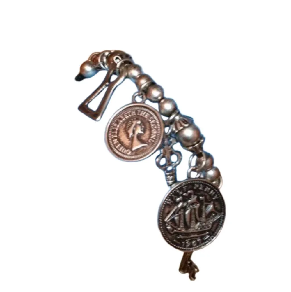 𝅺Vintage roll on dangle charm bracelet with coins and keys antique silver tone.